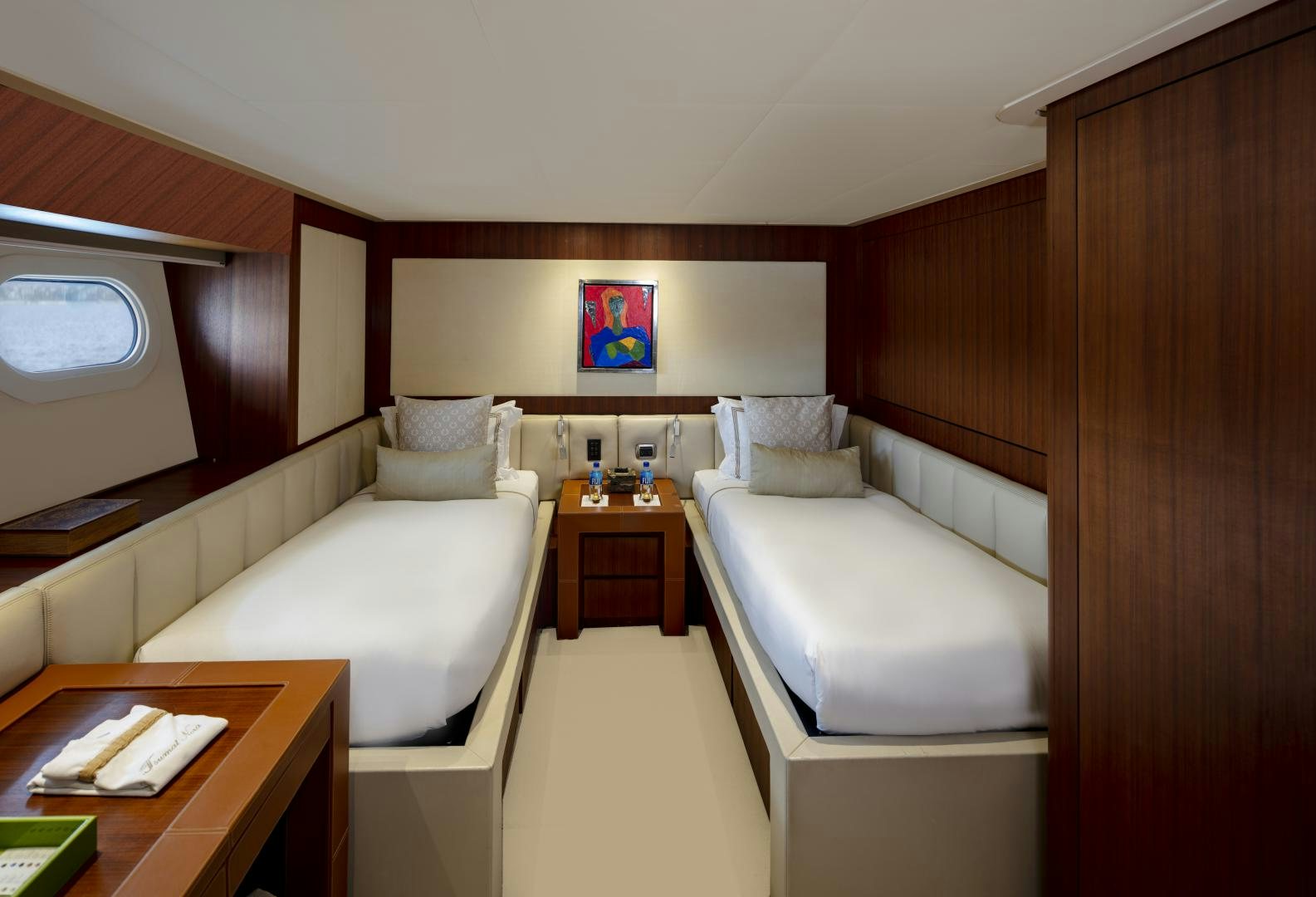 a room with a bed and a desk aboard CHAMPAGNE SEAS Yacht for Sale
