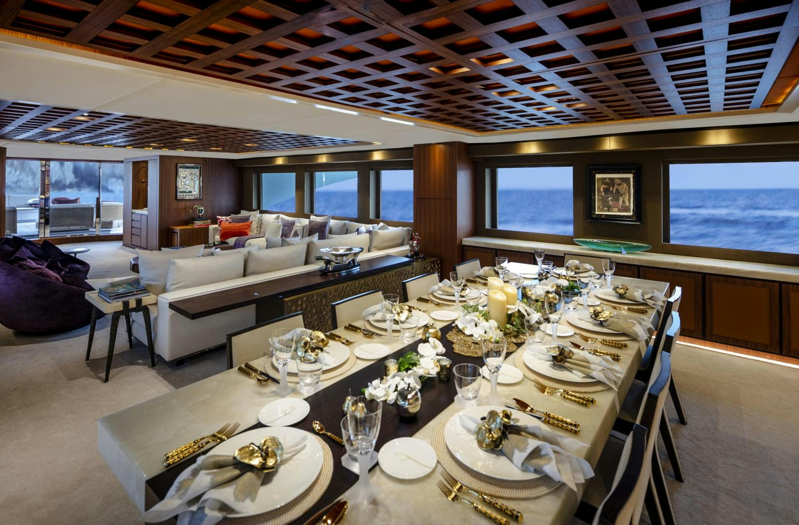 a large room with a table and chairs aboard CHAMPAGNE SEAS Yacht for Sale