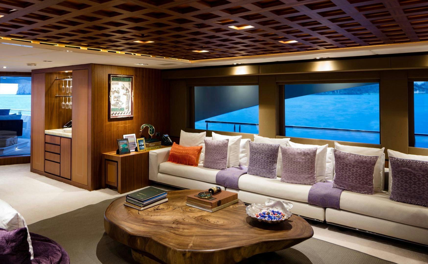 a living room with a large screen aboard CHAMPAGNE SEAS Yacht for Sale