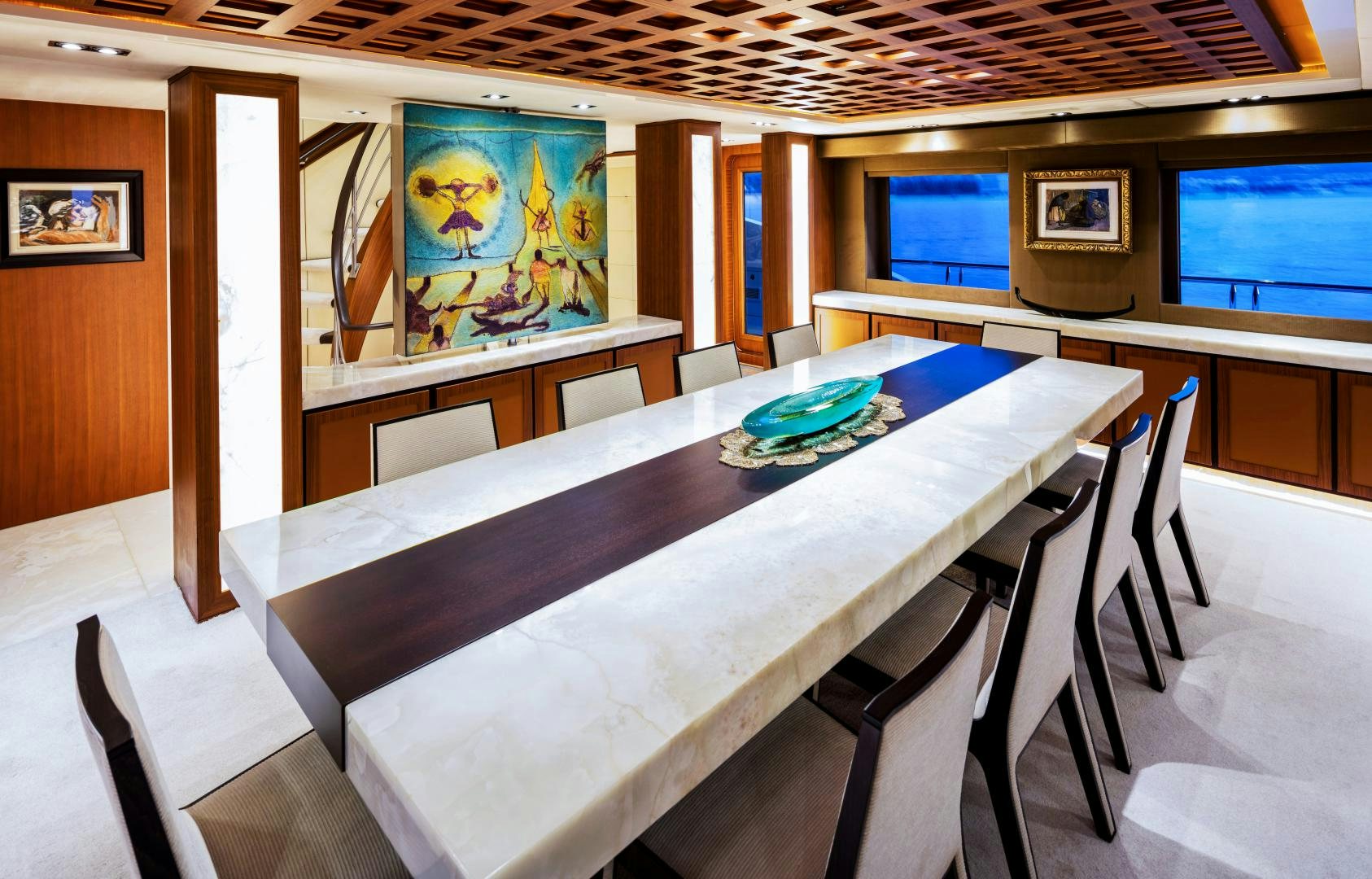 a room with tables and chairs aboard CHAMPAGNE SEAS Yacht for Sale