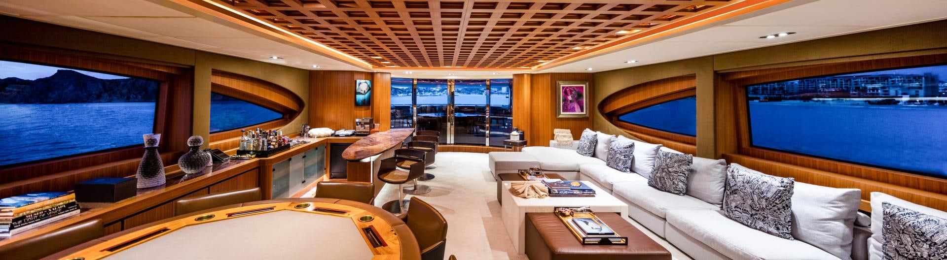 a room with a bed and a table aboard CHAMPAGNE SEAS Yacht for Sale