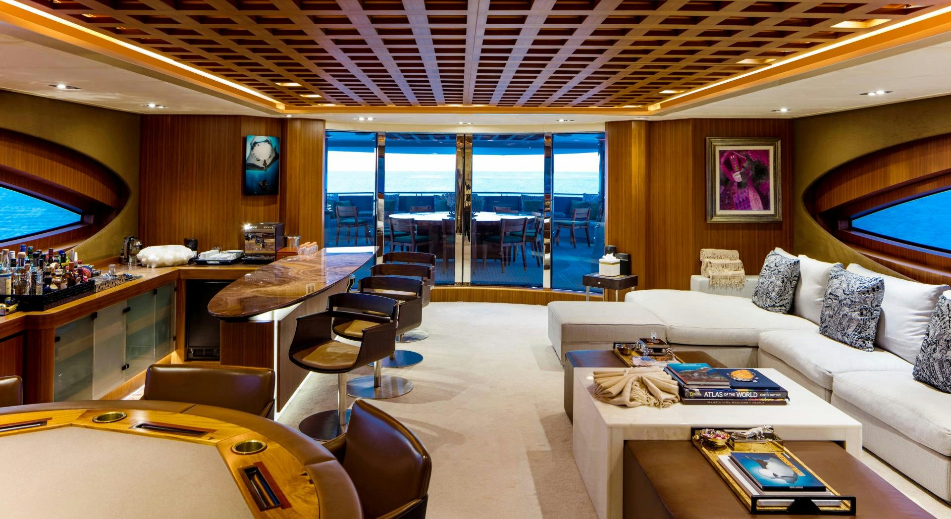 a living room with a large window aboard CHAMPAGNE SEAS Yacht for Sale