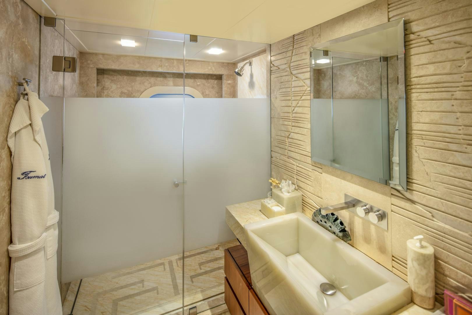 a bathroom with a bathtub sink and a shower aboard CHAMPAGNE SEAS Yacht for Sale