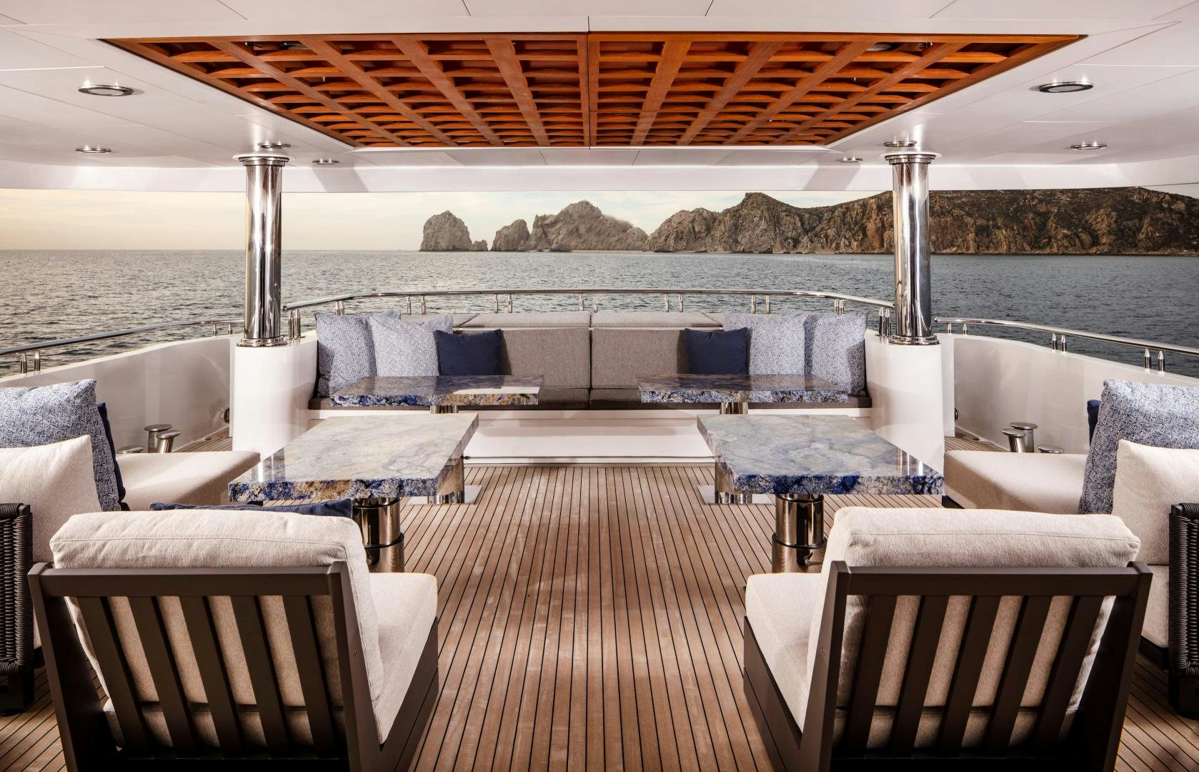 a deck with chairs and tables on it aboard CHAMPAGNE SEAS Yacht for Charter