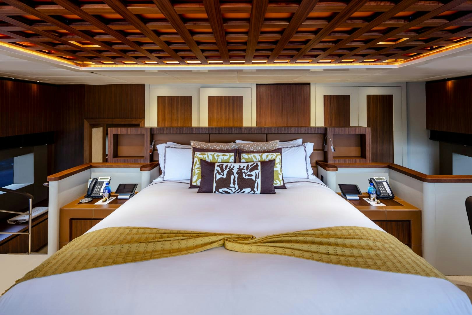 a bed with a white sheet and pillows aboard CHAMPAGNE SEAS Yacht for Sale