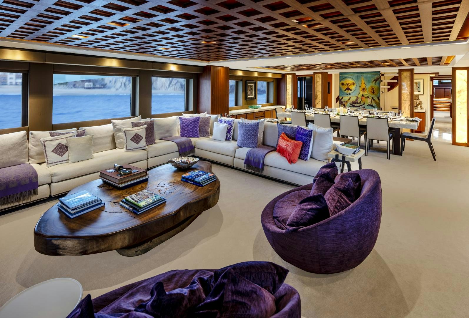a living room with a couch and a table aboard CHAMPAGNE SEAS Yacht for Charter