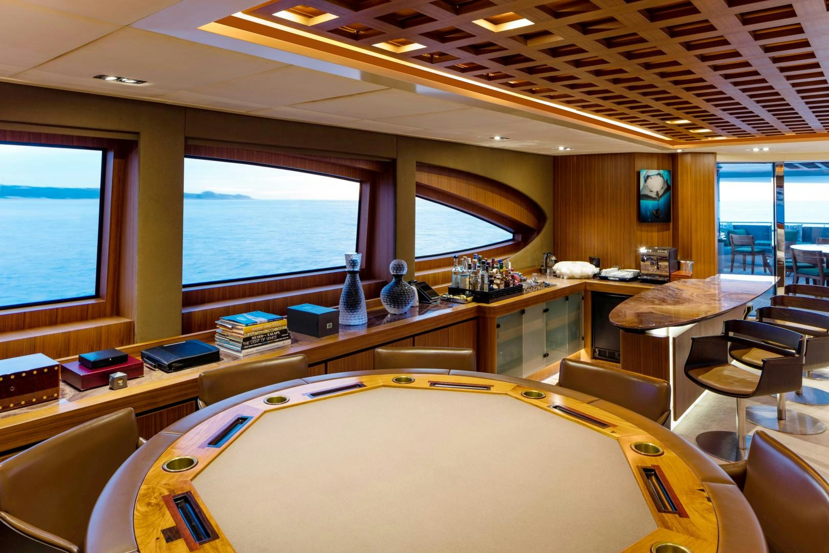 inside of a vehicle with tables and chairs and a window aboard CHAMPAGNE SEAS Yacht for Sale