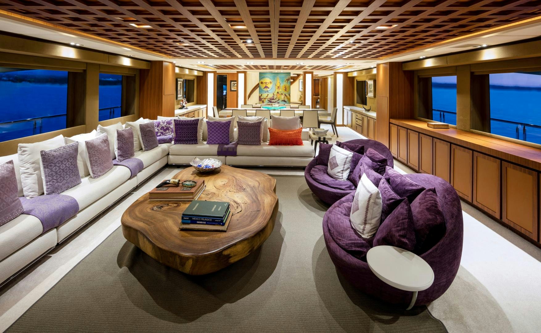 a large room with a couch and a table aboard CHAMPAGNE SEAS Yacht for Sale