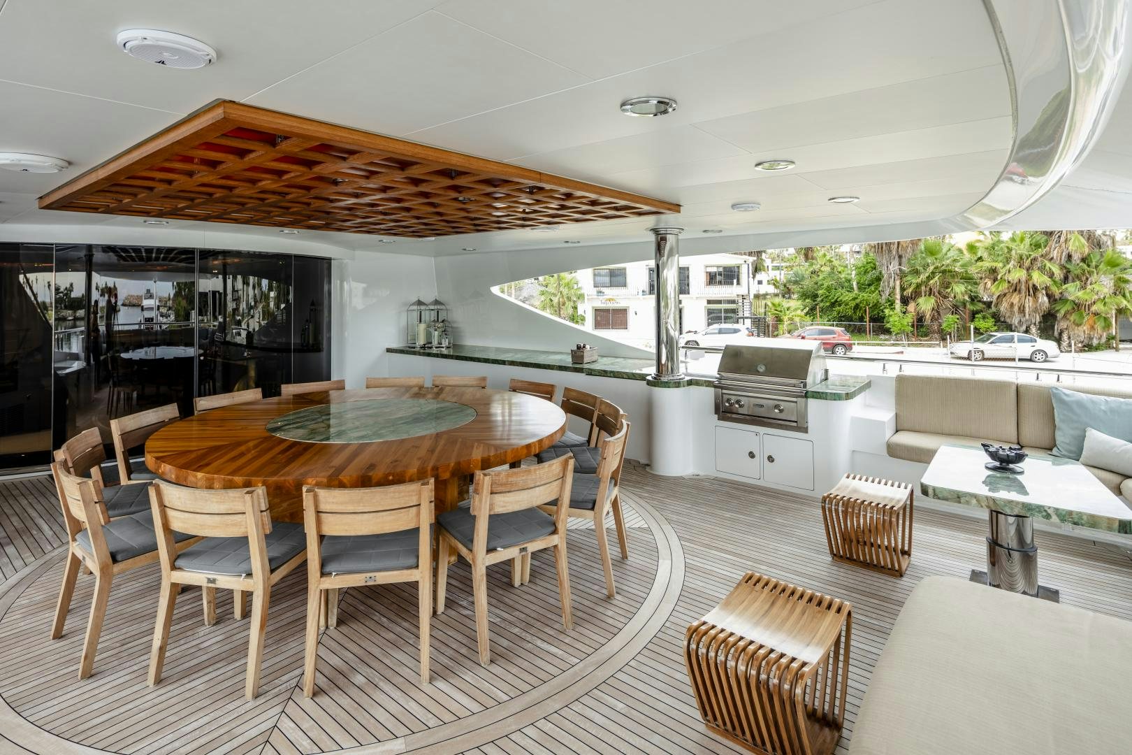 a large open living room with a table and chairs aboard CHAMPAGNE SEAS Yacht for Sale