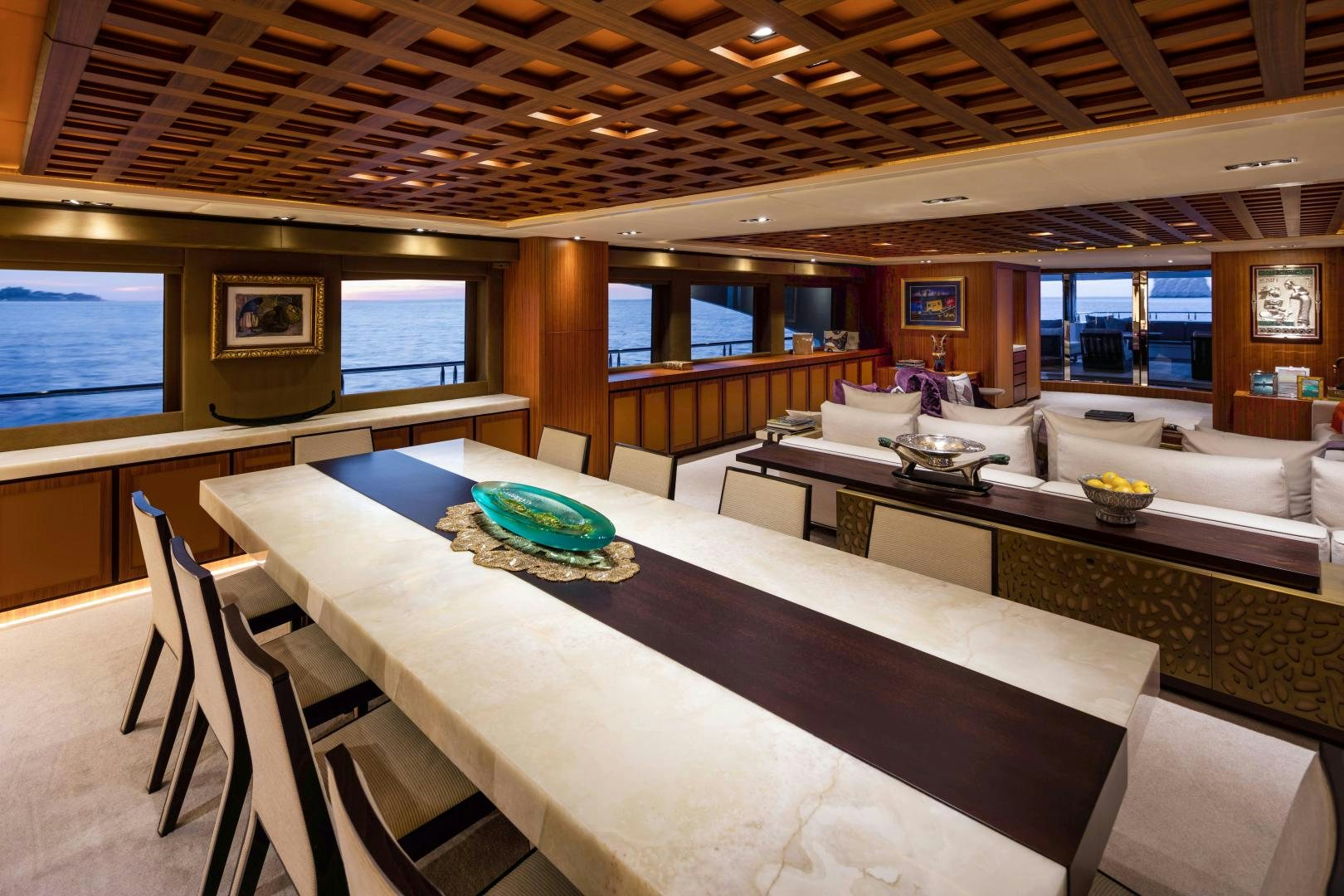 a large room with tables and chairs aboard CHAMPAGNE SEAS Yacht for Sale