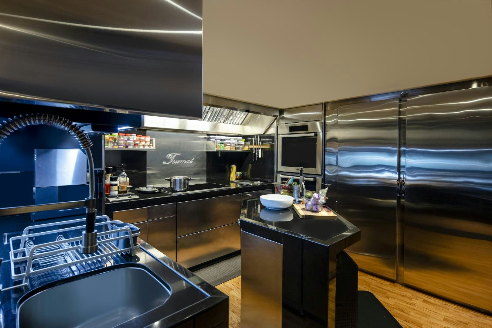 a kitchen with a sink and a tv aboard CHAMPAGNE SEAS Yacht for Sale