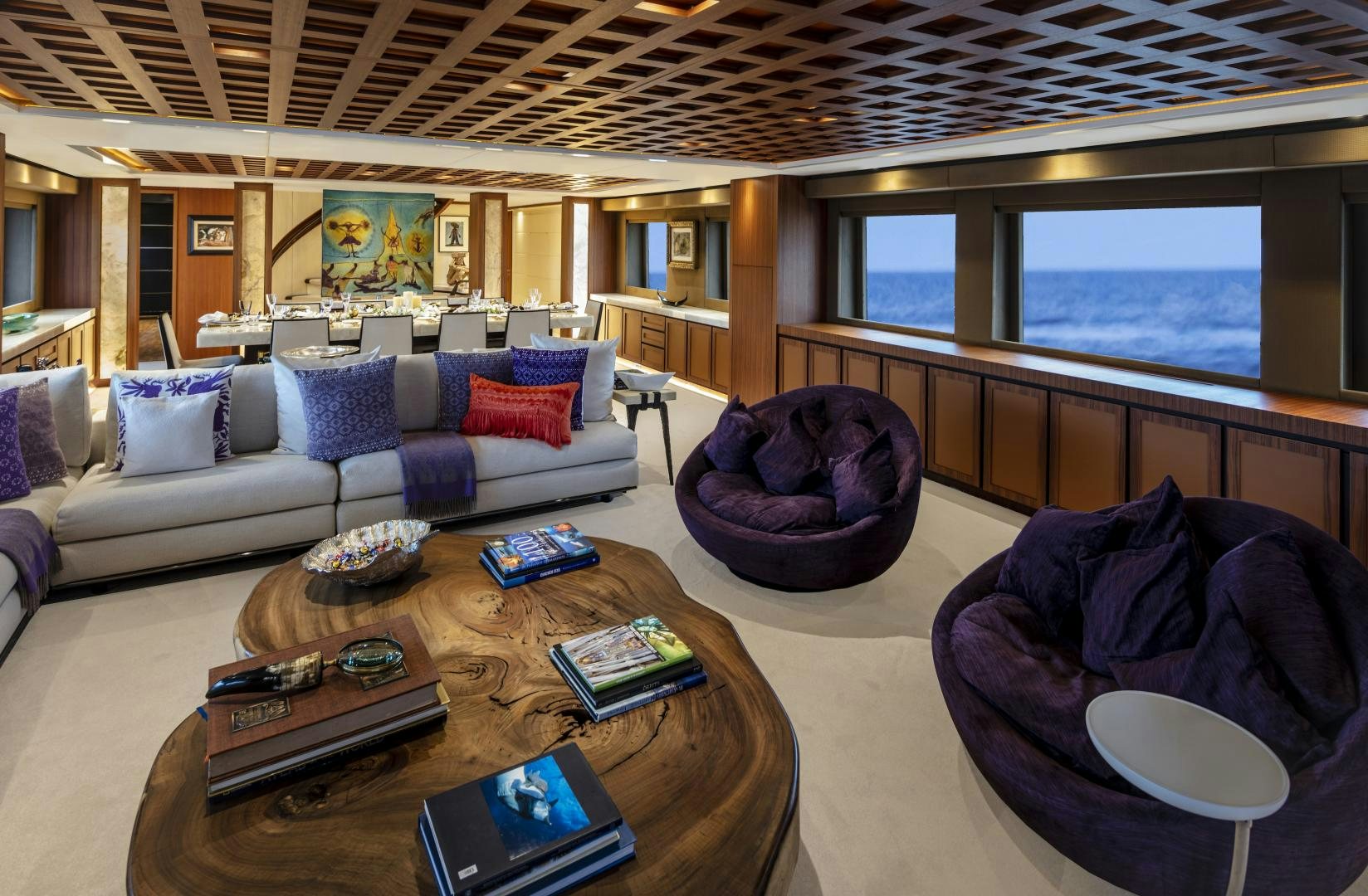 a living room with a couch and a table aboard CHAMPAGNE SEAS Yacht for Sale