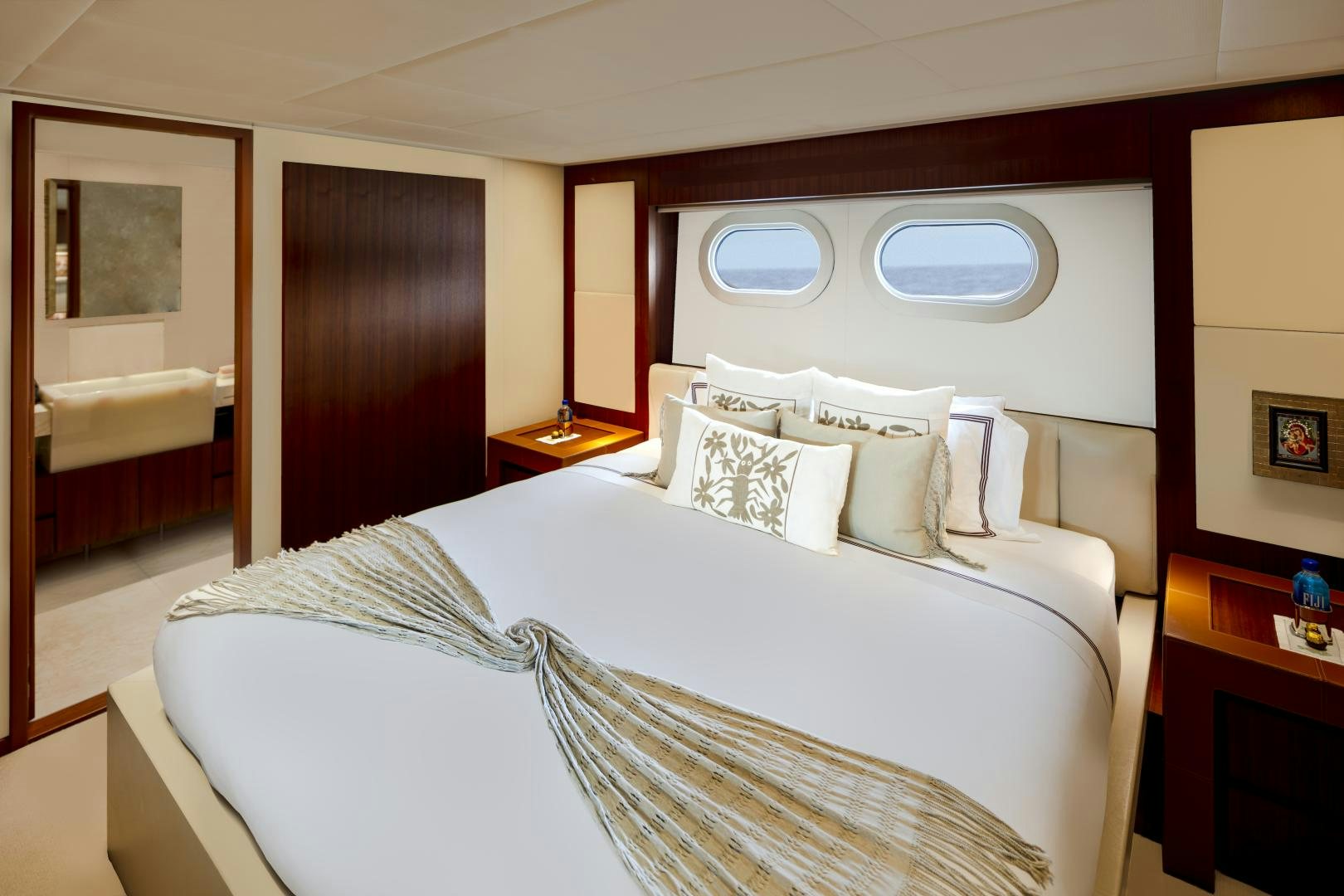 a bed with white sheets aboard CHAMPAGNE SEAS Yacht for Sale