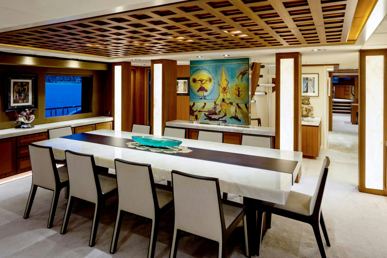 a large room with a table and chairs aboard CHAMPAGNE SEAS Yacht for Sale