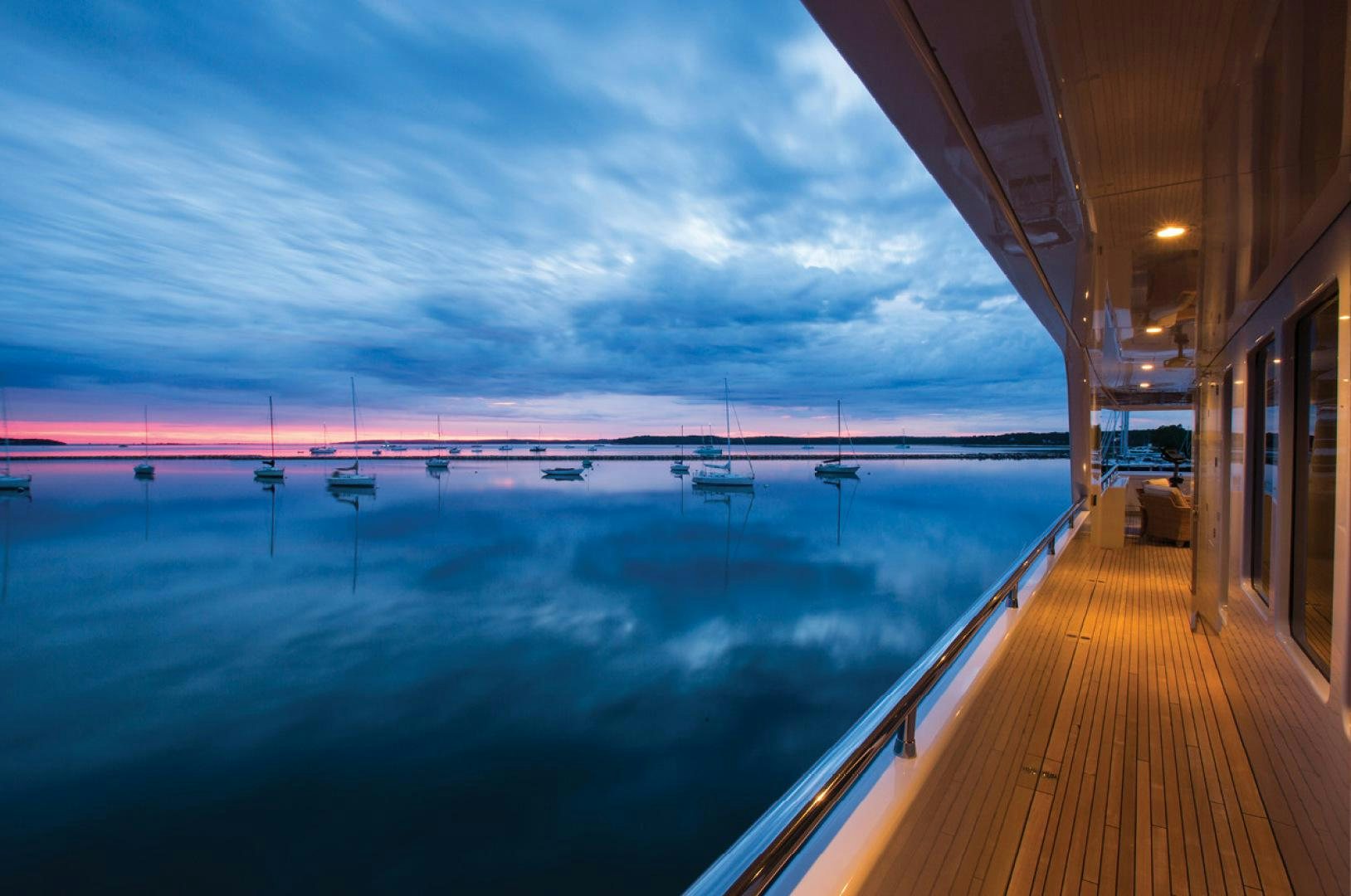 a wooden deck with a pool aboard RHINO Yacht for Sale