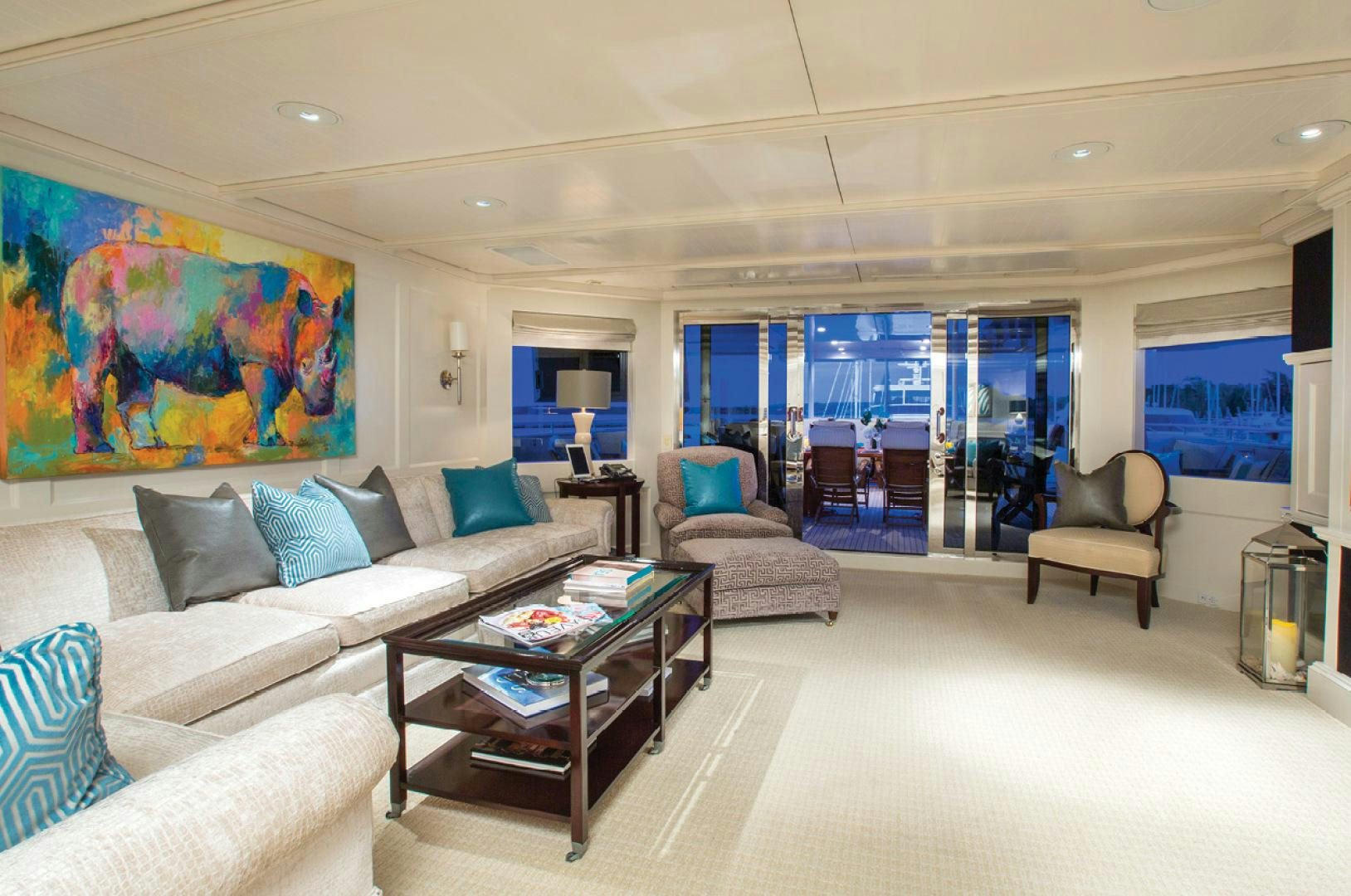 a living room with a large window aboard RHINO Yacht for Sale