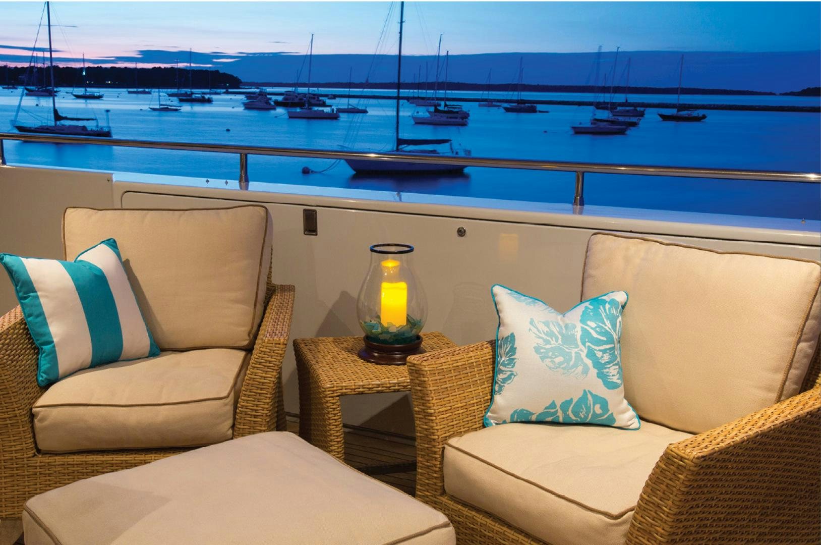 a living room with a view of the water and the city aboard RHINO Yacht for Sale