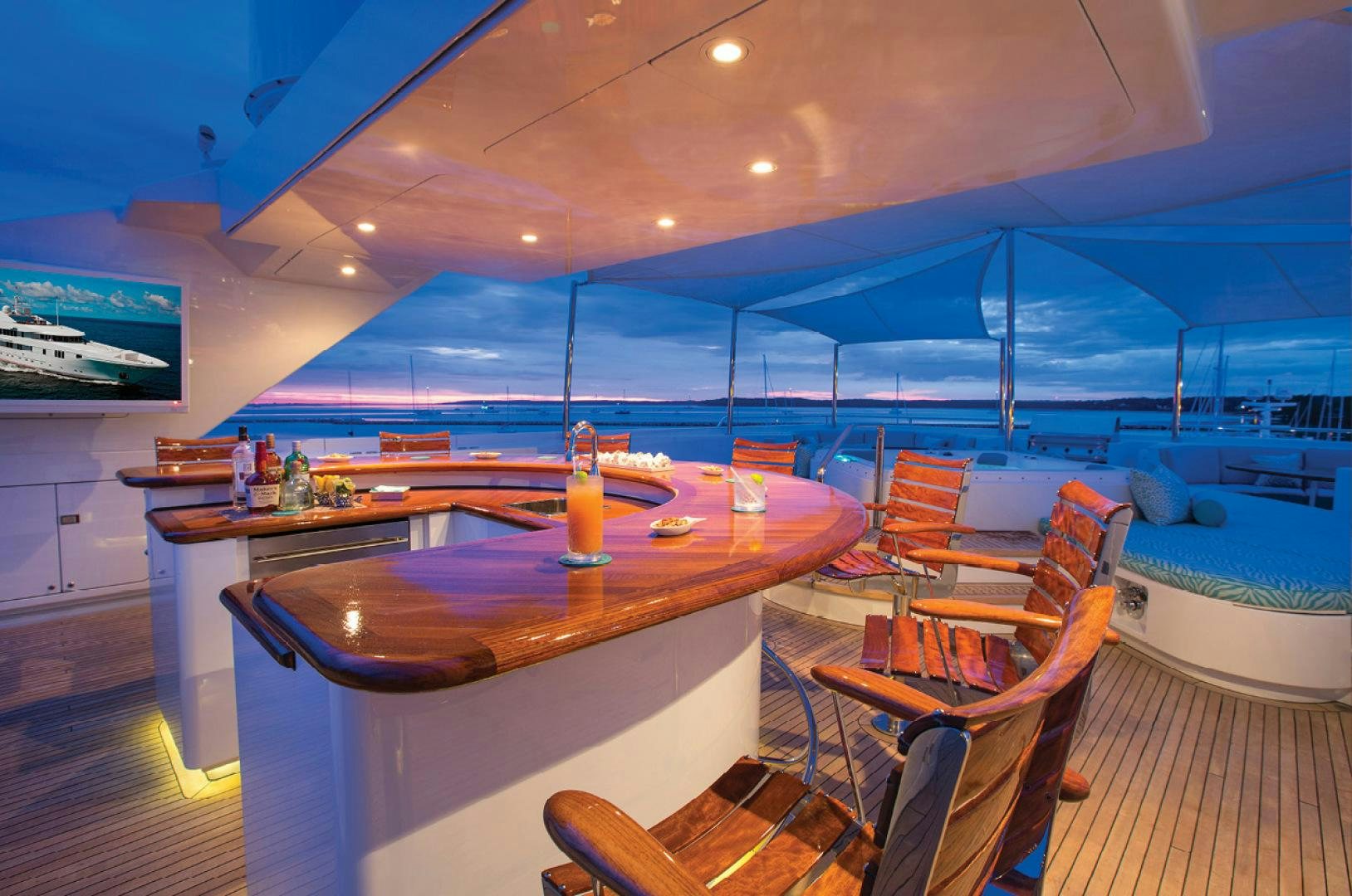 a bar with a table and chairs aboard RHINO Yacht for Sale