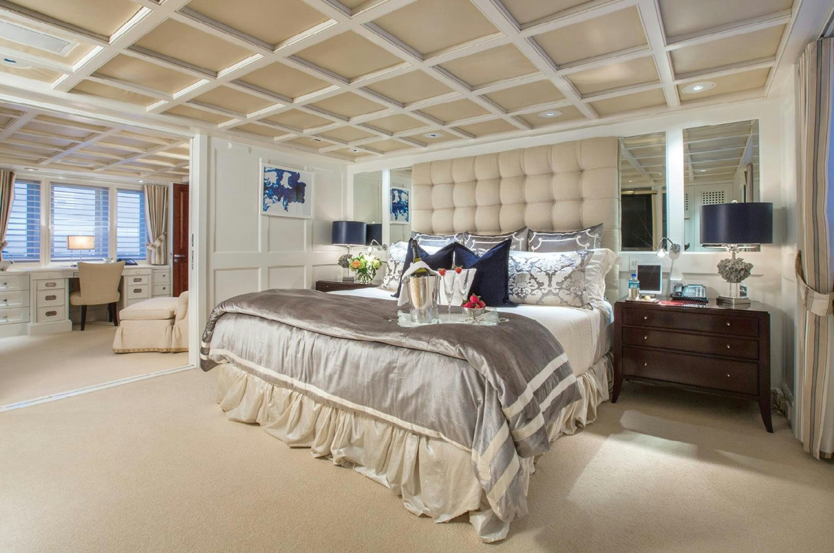 a large bedroom with a large bed aboard RHINO Yacht for Sale