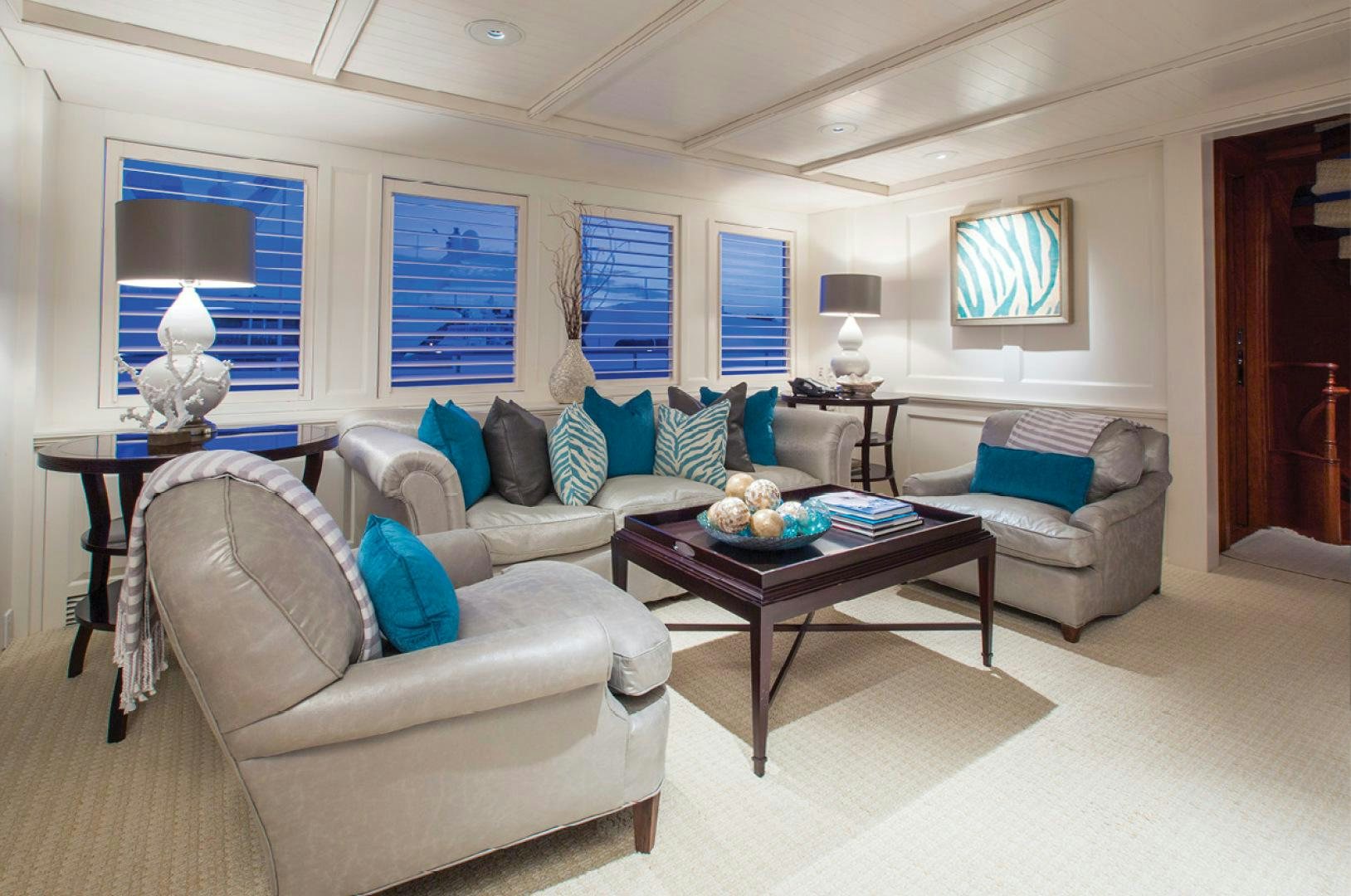 a living room with a couch and a coffee table aboard RHINO Yacht for Sale