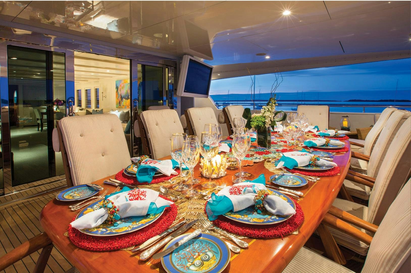a table with plates and plates aboard RHINO Yacht for Sale