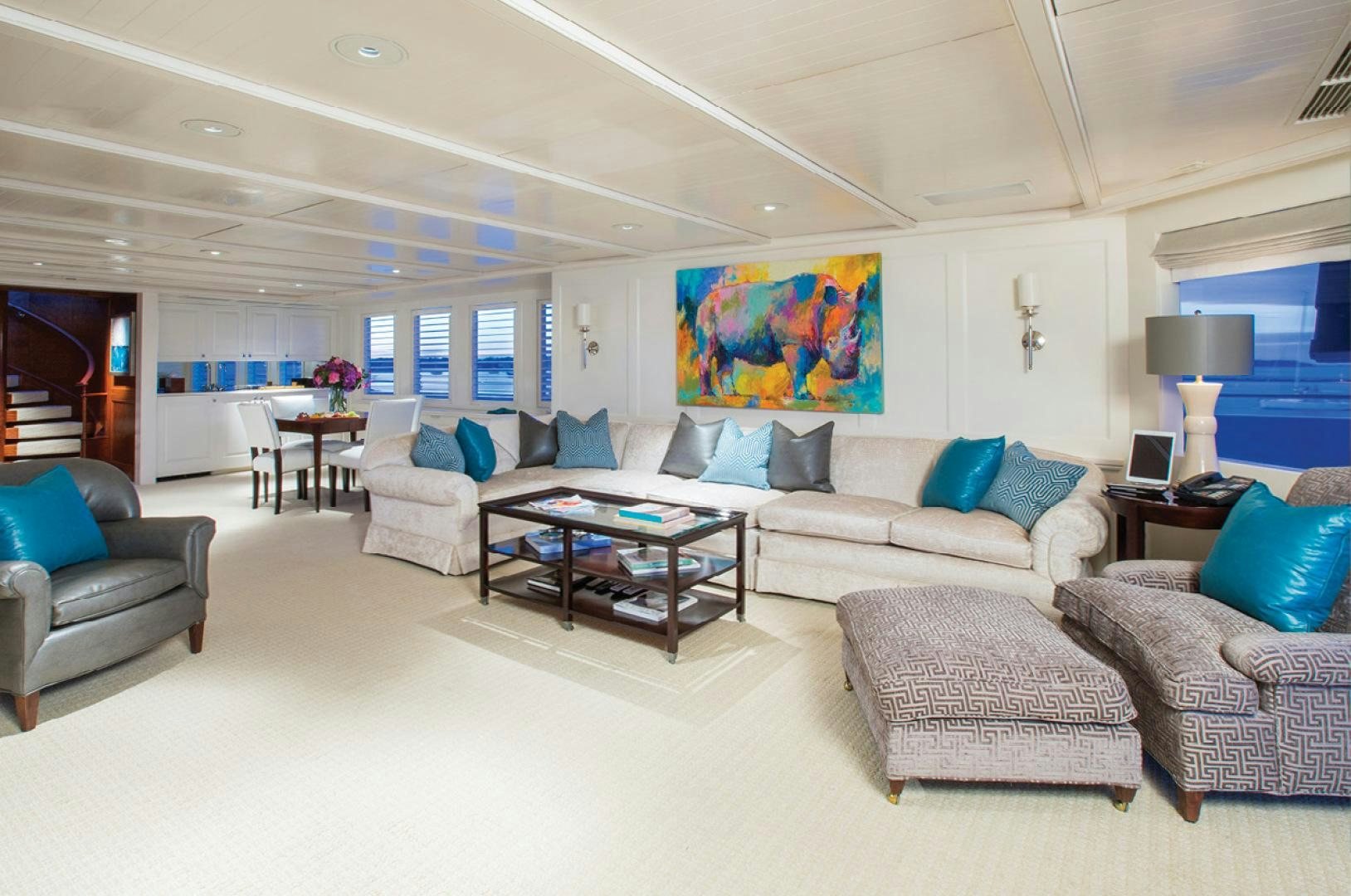a living room with a couch and a coffee table aboard RHINO Yacht for Sale