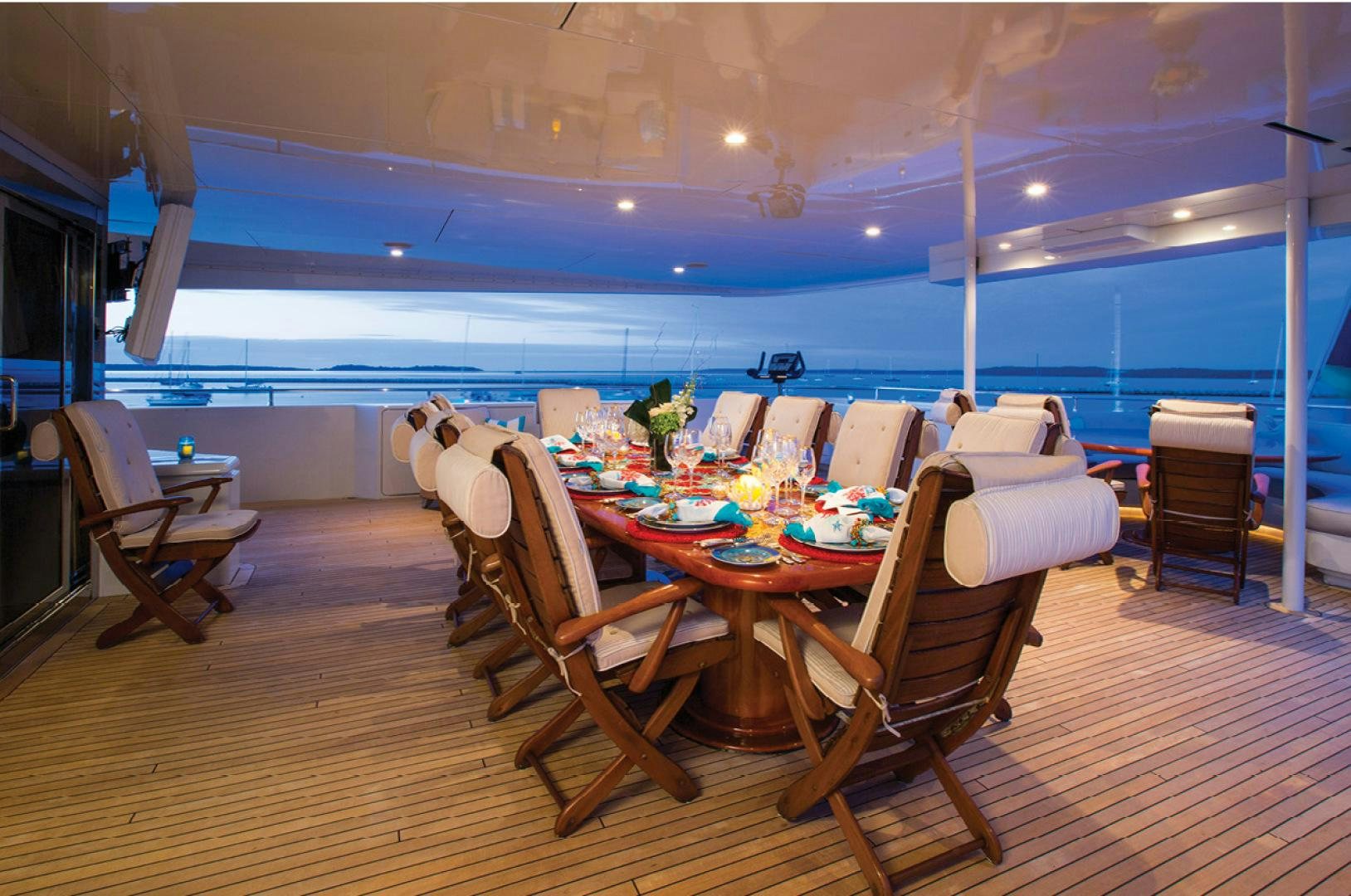 a room with a table and chairs aboard RHINO Yacht for Sale