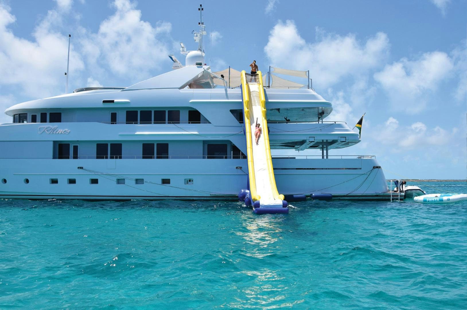 a large white boat in the water aboard RHINO Yacht for Sale