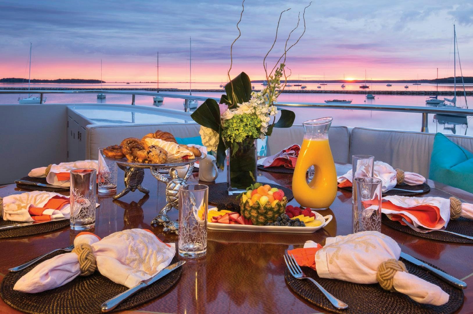 a table with food and drinks aboard RHINO Yacht for Sale