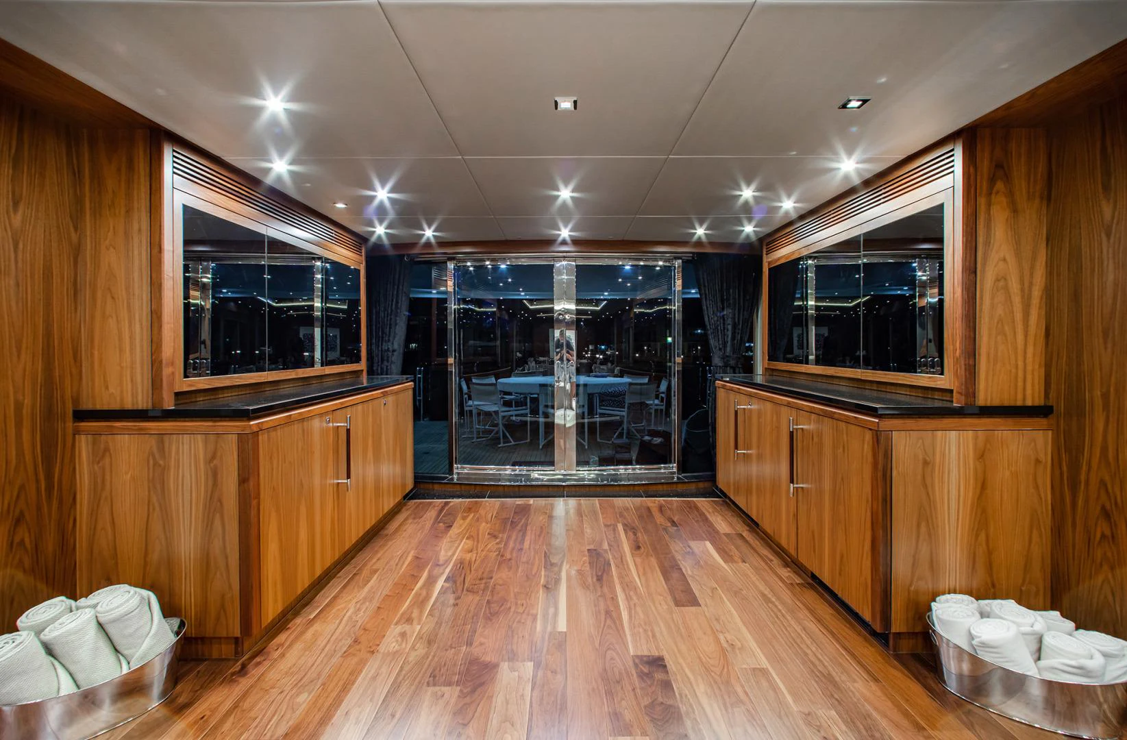 a room with wooden cabinets and a wood floor aboard MARIN Yacht for Sale