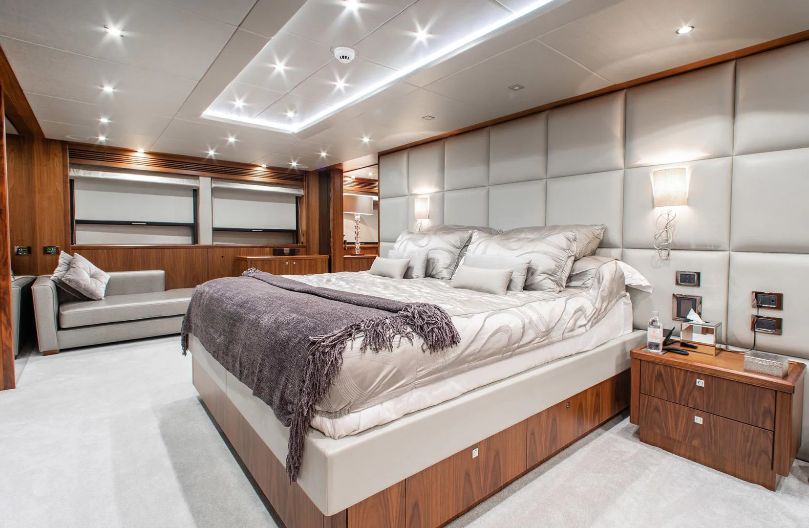 a bedroom with a bed and a couch aboard MARIN Yacht for Sale