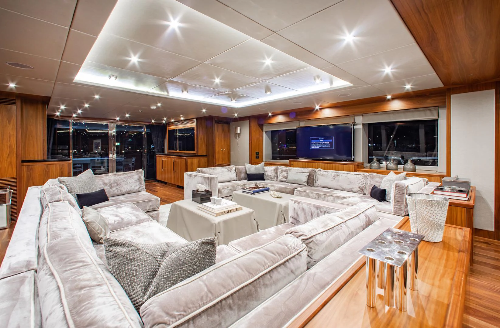 a large living room with a large couch and a large screen aboard MARIN Yacht for Sale