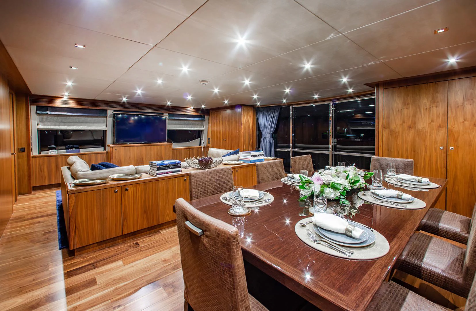 a large room with a table and chairs aboard MARIN Yacht for Sale