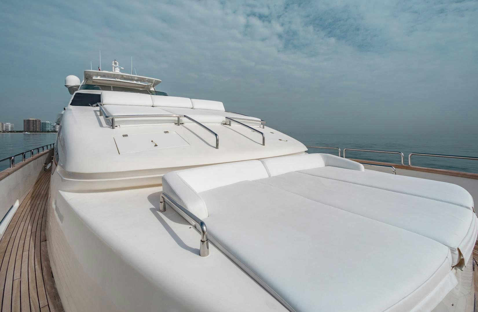 a white boat on a dock aboard ARREEE! Yacht for Sale