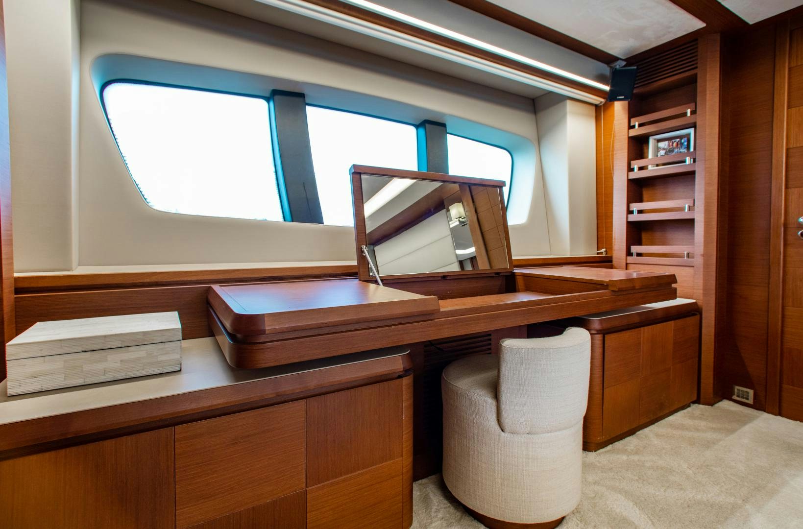 a room with a desk and a window aboard ARREEE! Yacht for Sale
