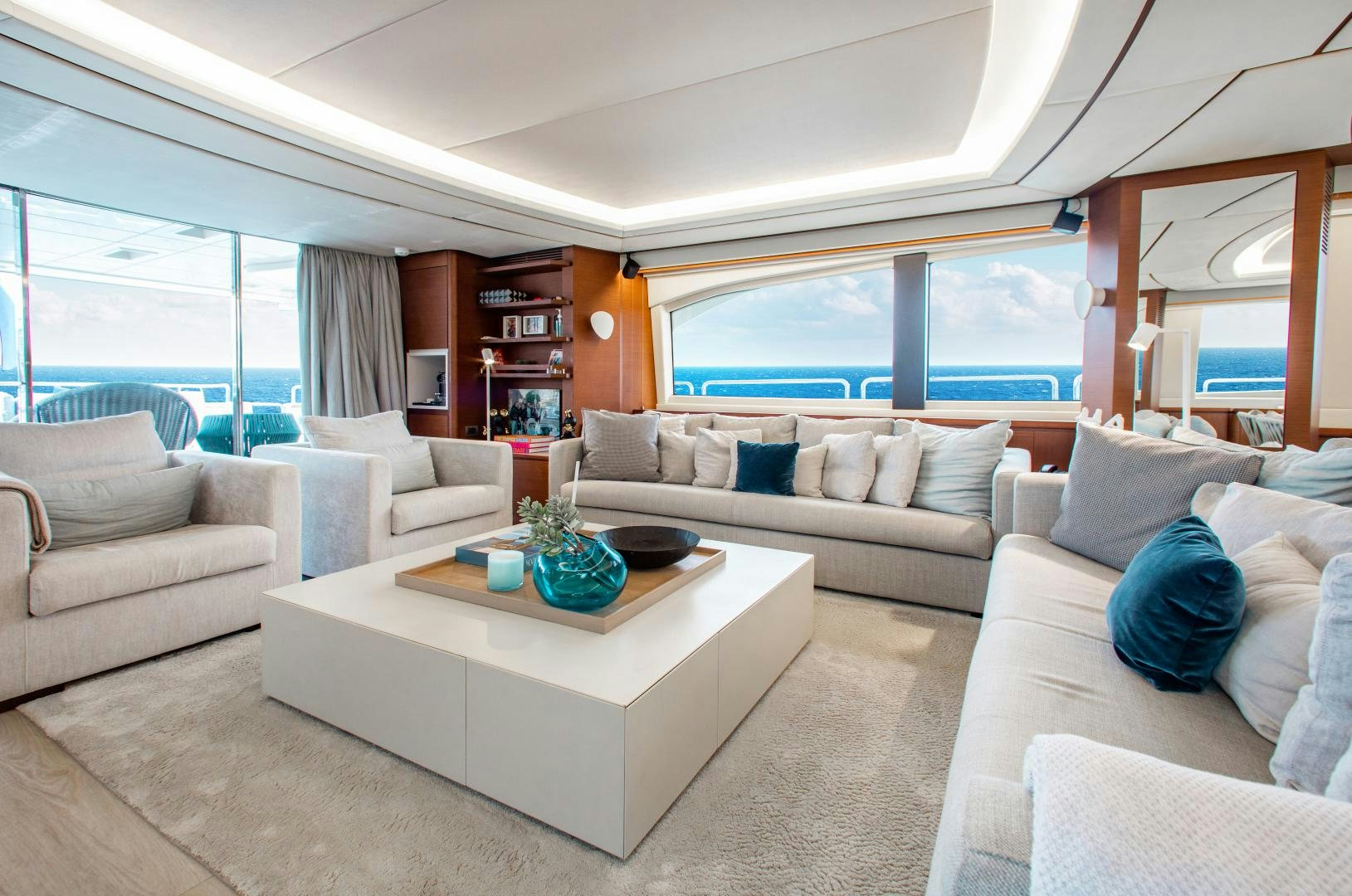 a living room with a large window aboard ARREEE! Yacht for Sale