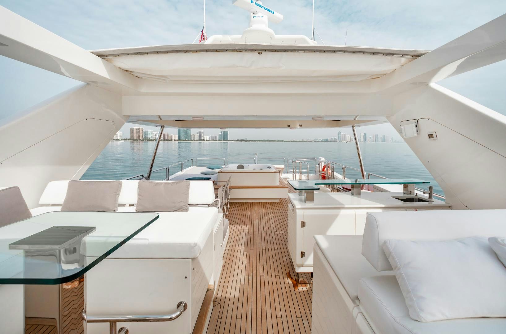 a boat with a deck and chairs aboard ARREEE! Yacht for Sale