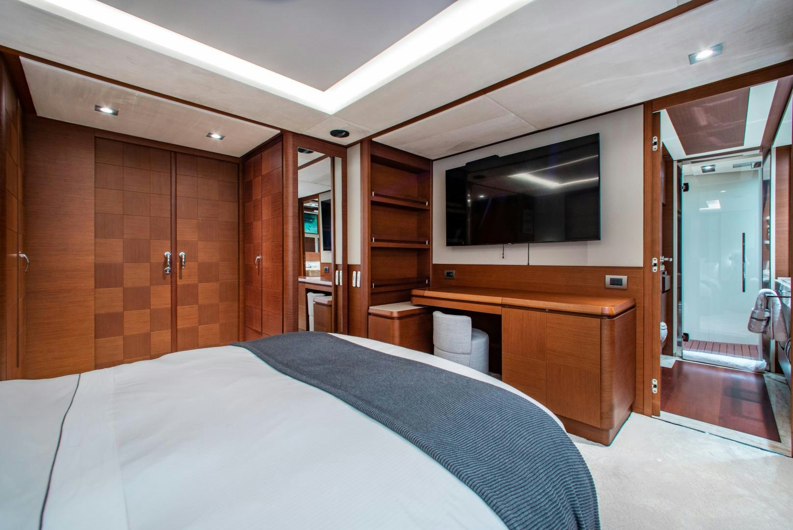 a hotel room with a bed and tv aboard ARREEE! Yacht for Sale