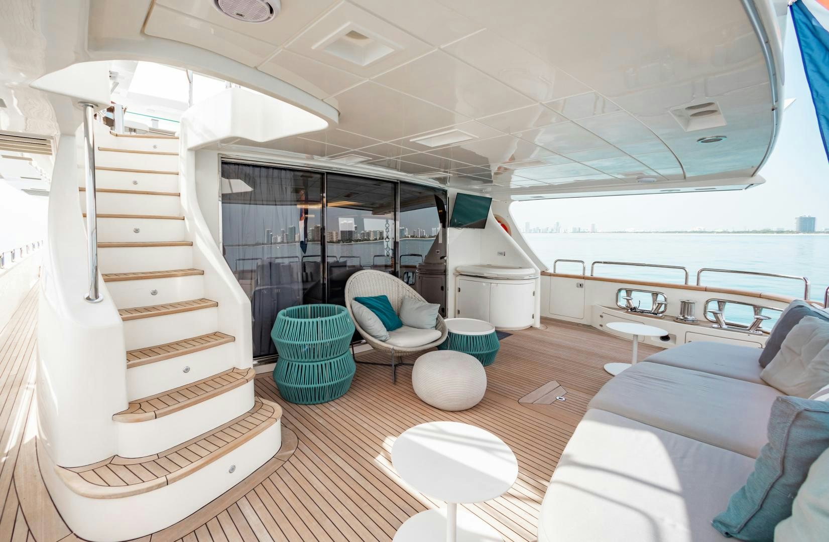 a room with a bed and a chair aboard ARREEE! Yacht for Sale