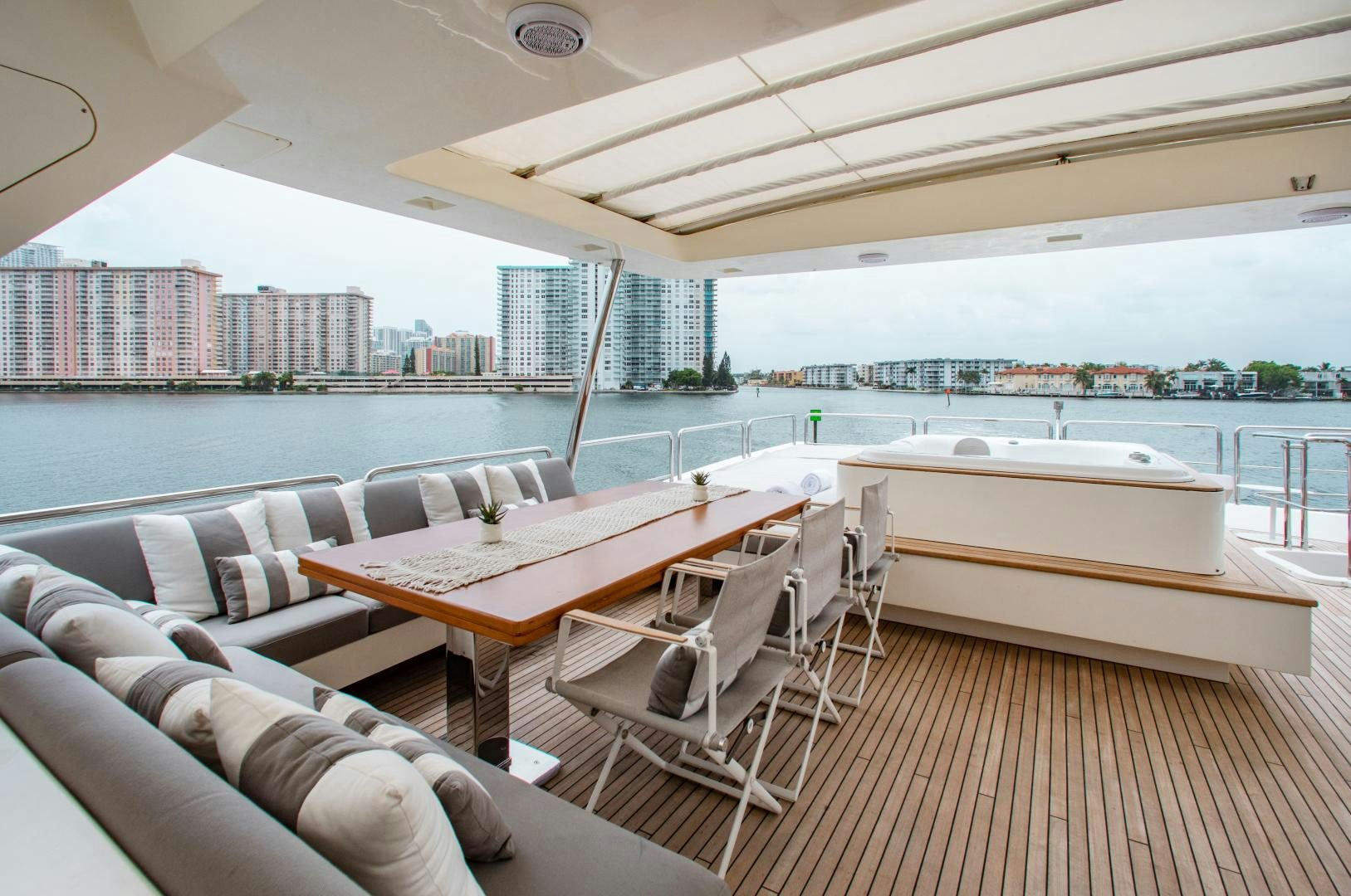 a room with a table and chairs aboard ARREEE! Yacht for Sale