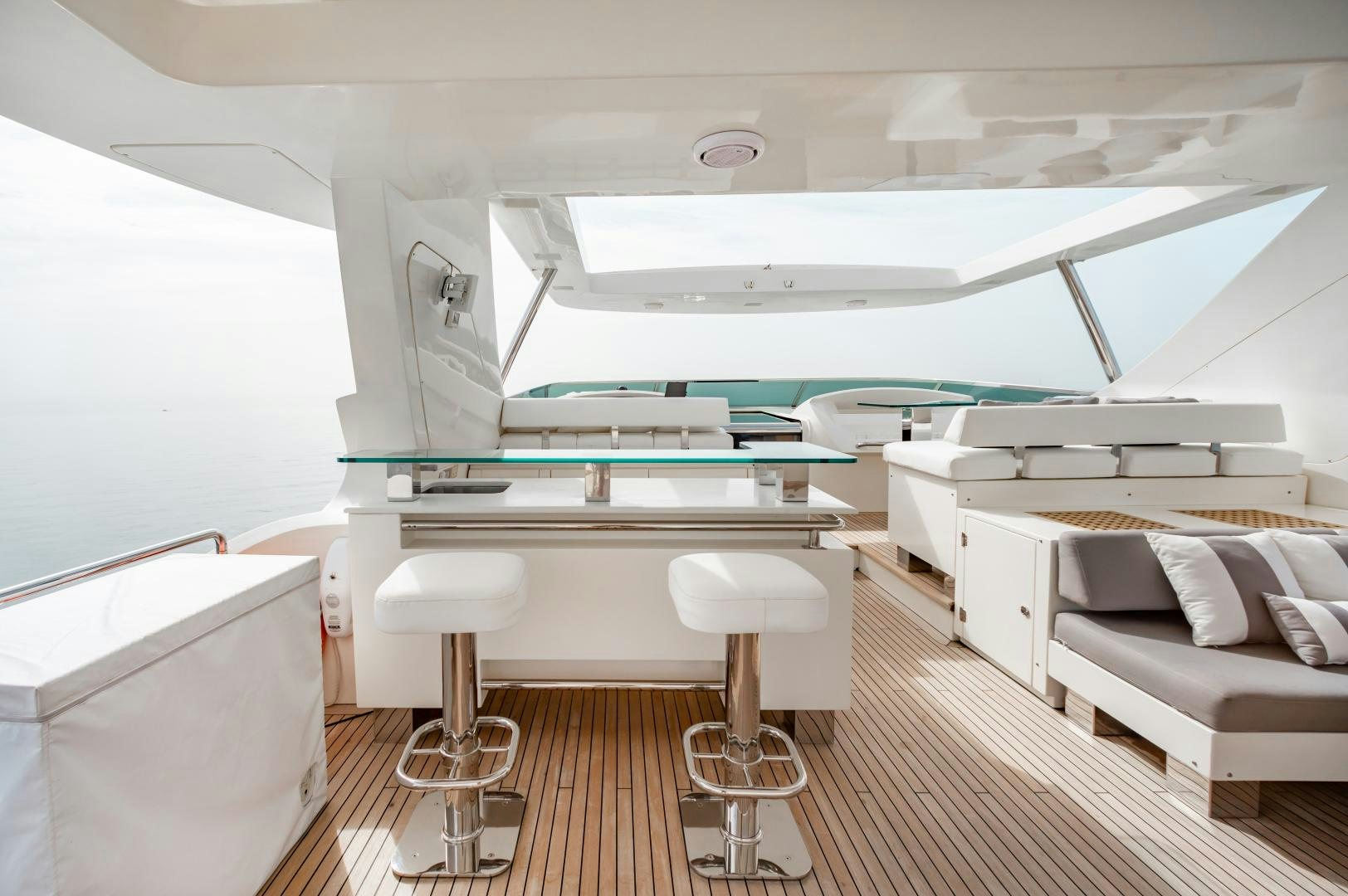 a room with a couch and a table aboard ARREEE! Yacht for Sale