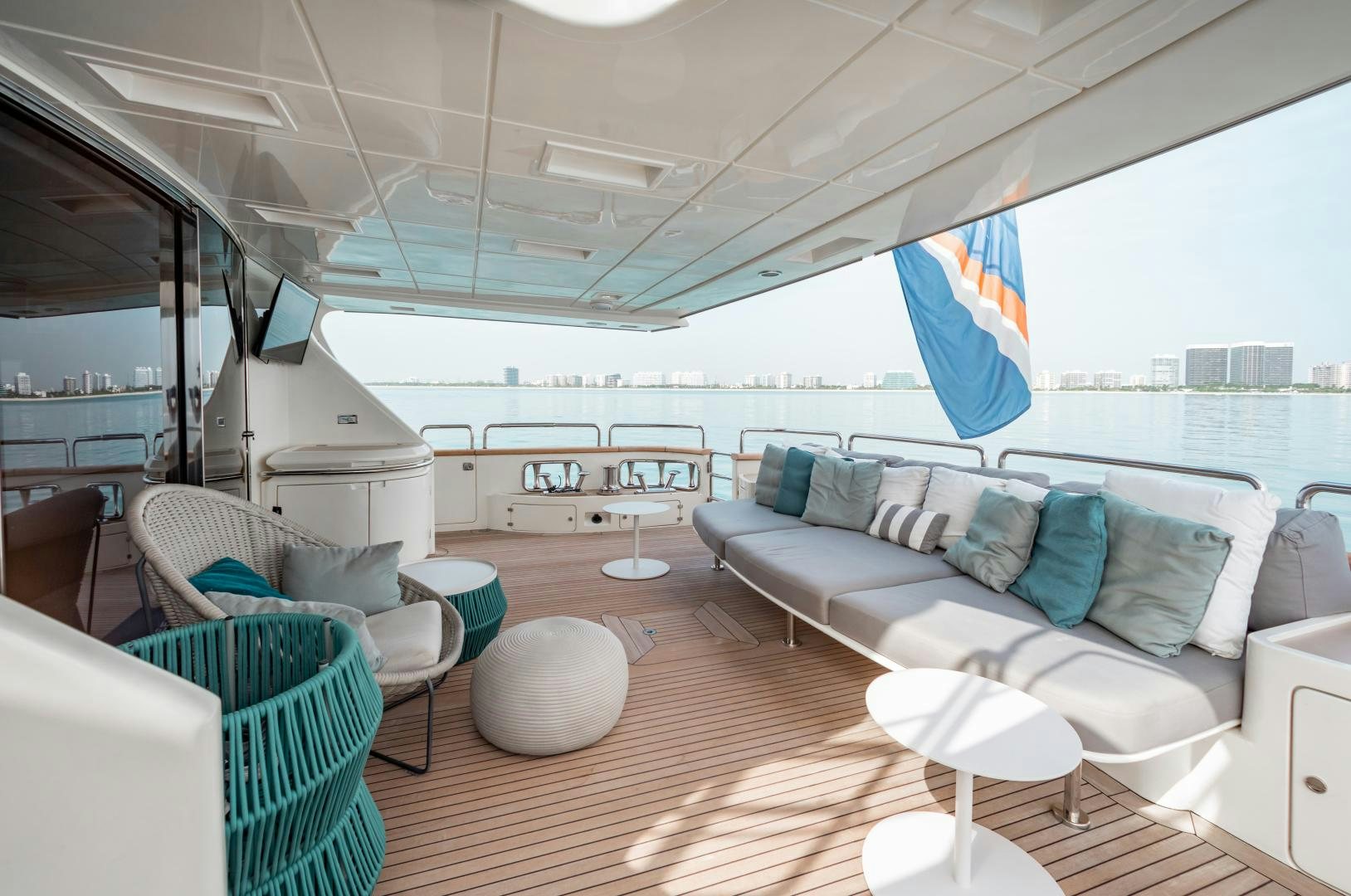 a living room with a large window aboard ARREEE! Yacht for Sale