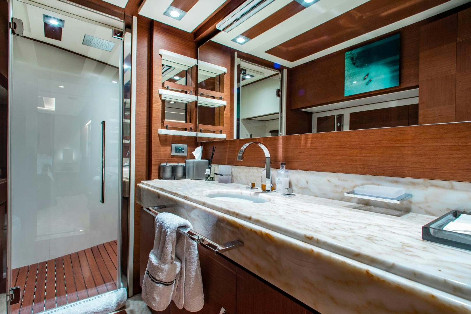 a bathroom with a sink and a mirror aboard ARREEE! Yacht for Sale