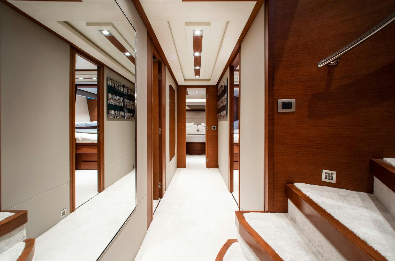 a hallway with a few doors aboard ARREEE! Yacht for Sale