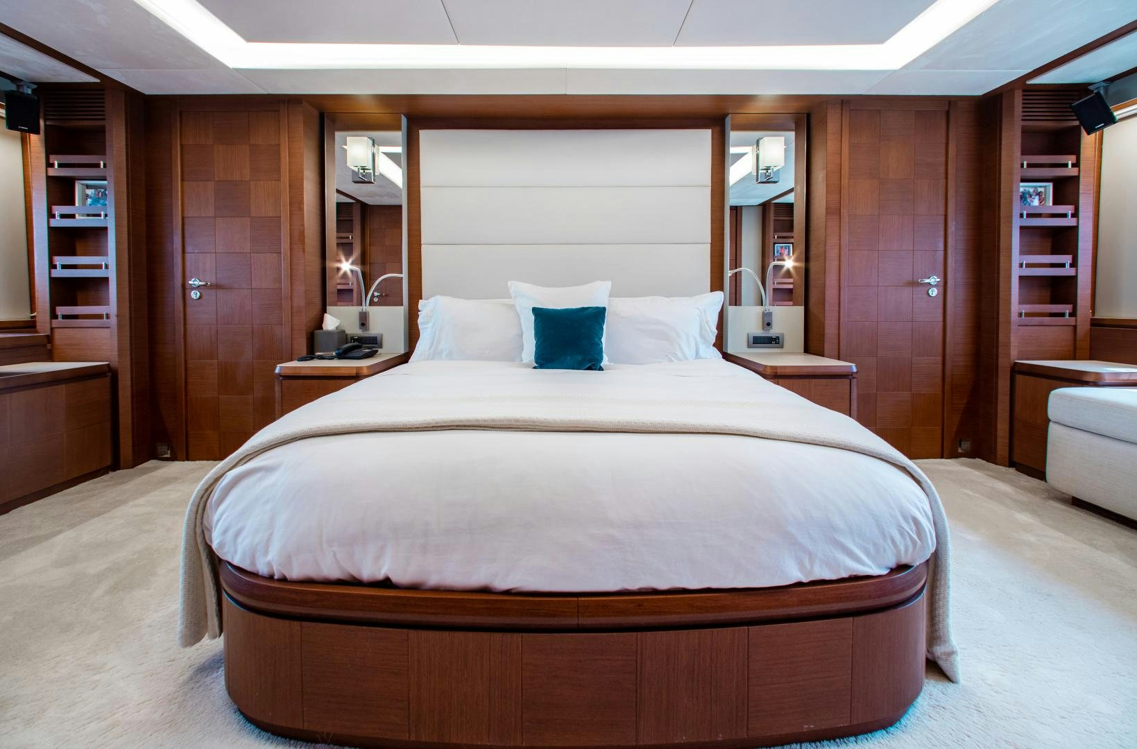 a large bed in a hotel room aboard ARREEE! Yacht for Sale