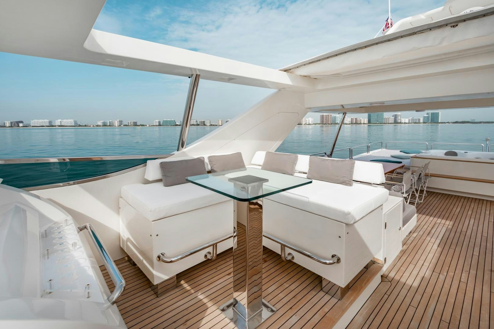 a large white lounge chair on a deck overlooking a large body of water aboard ARREEE! Yacht for Sale