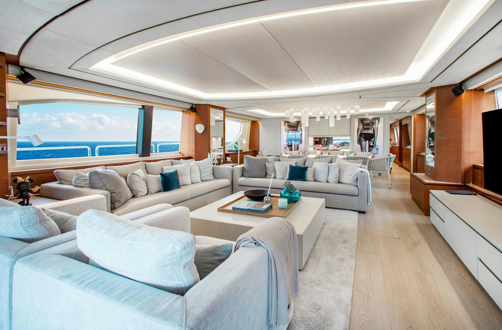 a living room with a large window aboard ARREEE! Yacht for Sale