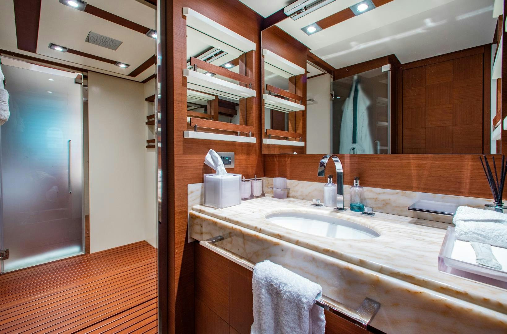 a bathroom with a sink and a mirror aboard ARREEE! Yacht for Sale