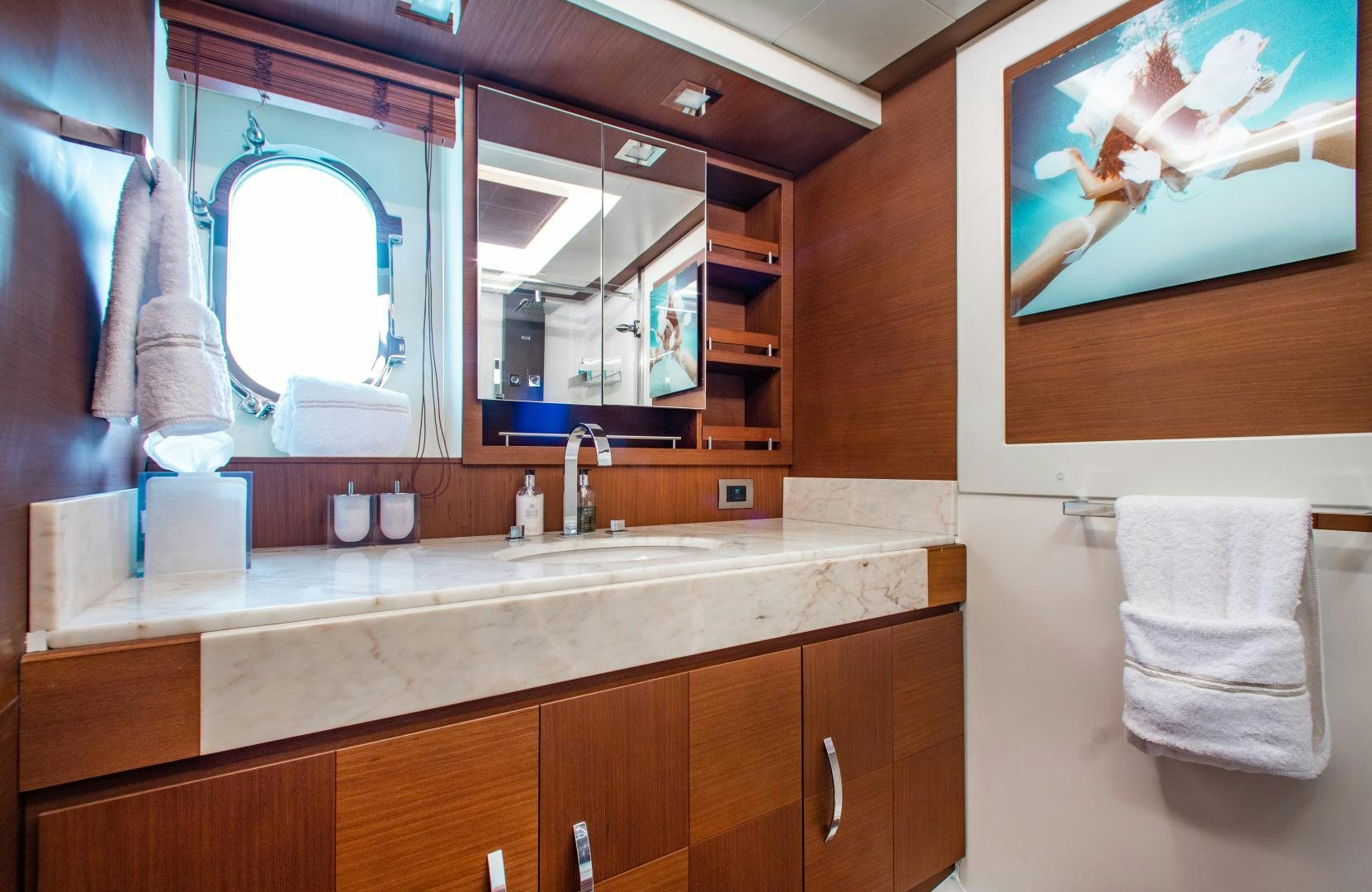a bathroom with a large mirror aboard ARREEE! Yacht for Sale