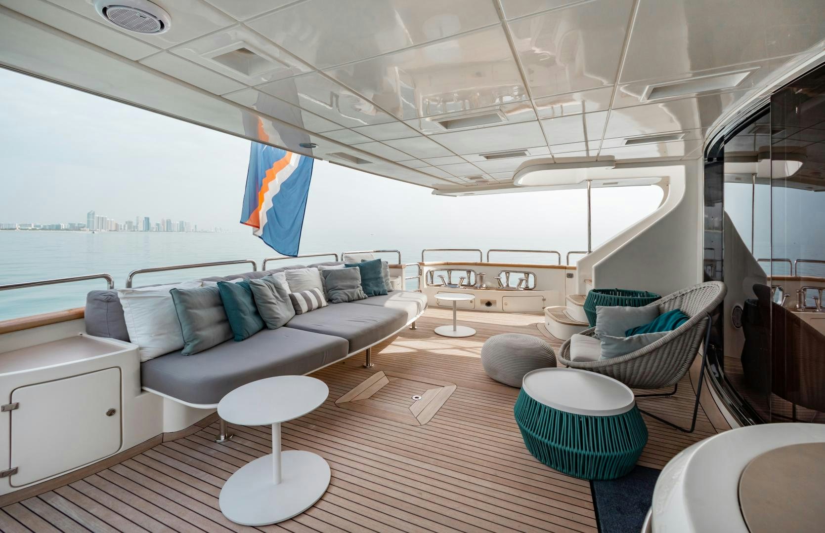 a living room with a couch and a table aboard ARREEE! Yacht for Sale